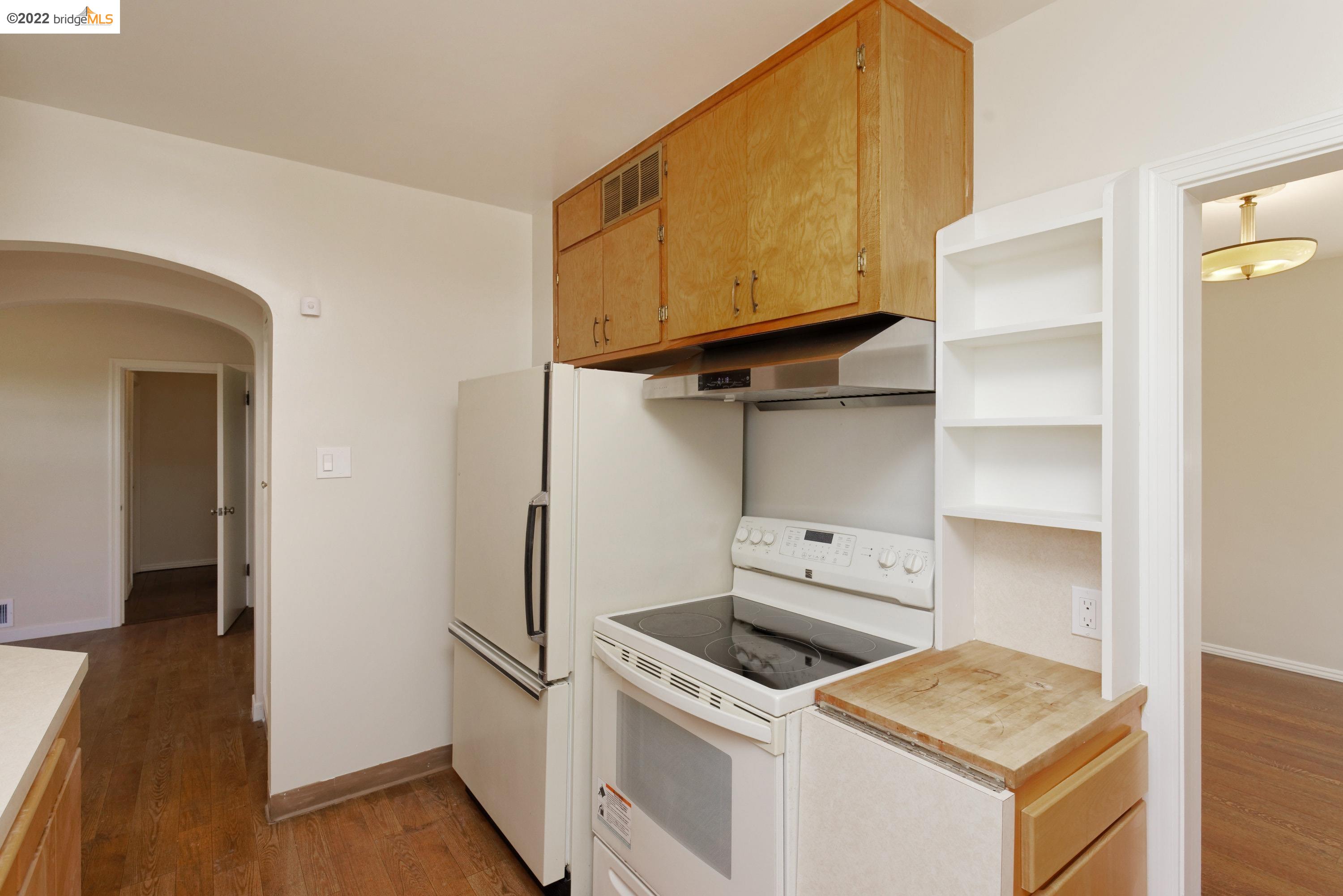 920 Spruce Street Berkeley, CA 94707 - Photo 13 of 36 a kitchen with a stove and a refrigerator