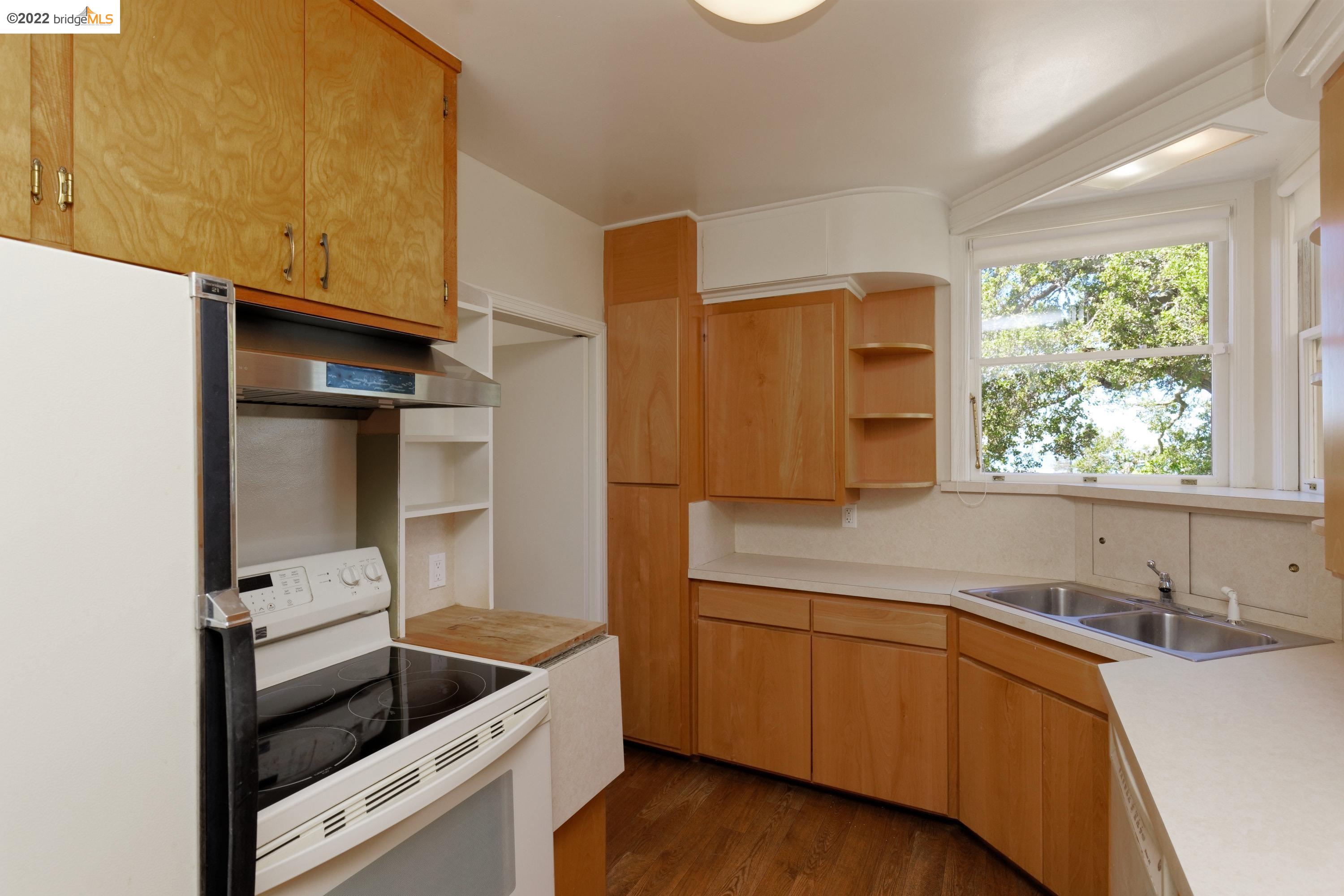 920 Spruce Street Berkeley, CA 94707 - Photo 14 of 36 a kitchen with a sink and cabinets