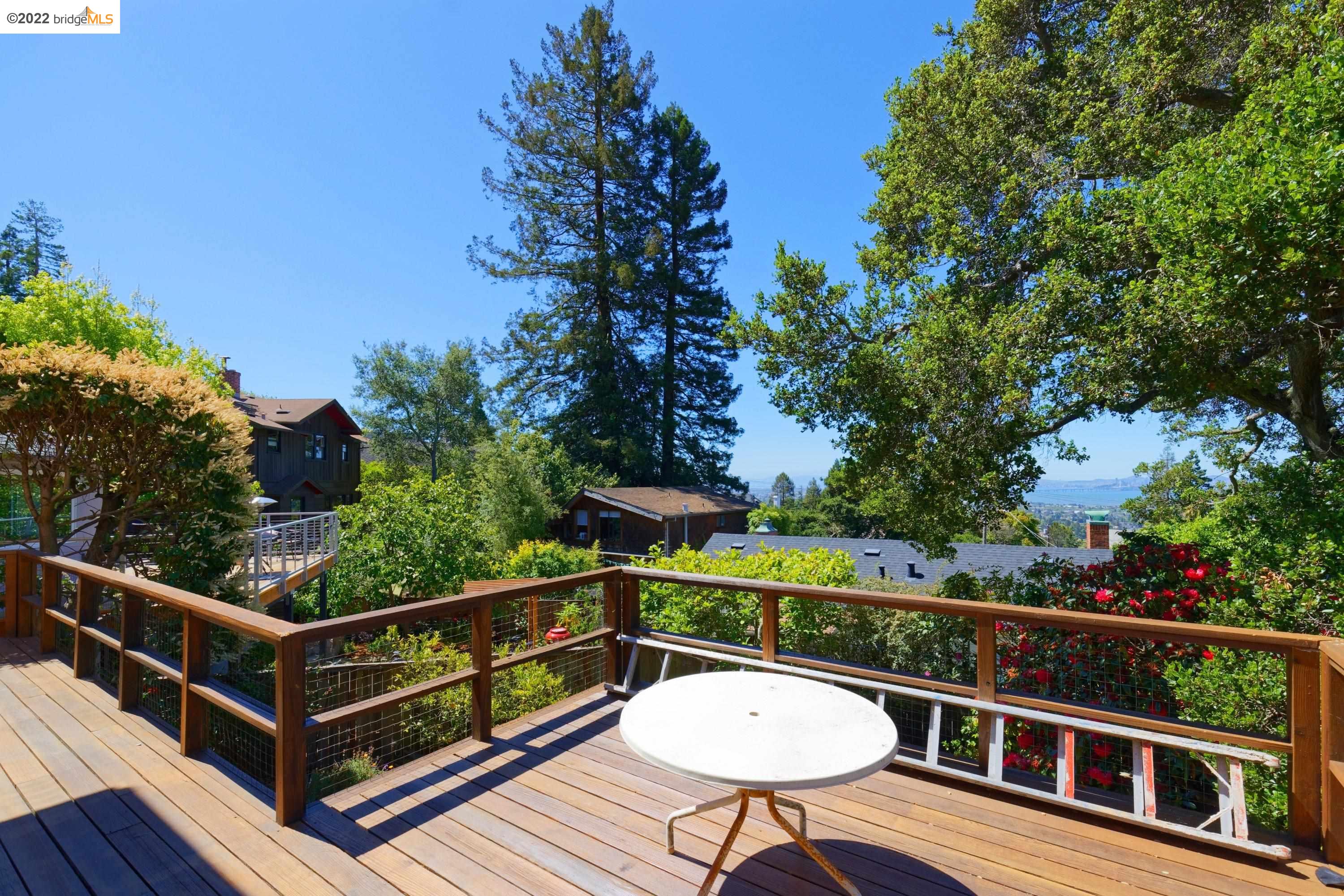 920 Spruce Street Berkeley, CA 94707 - Photo 6 of 36 a view of a chairs and table on the wooden deck