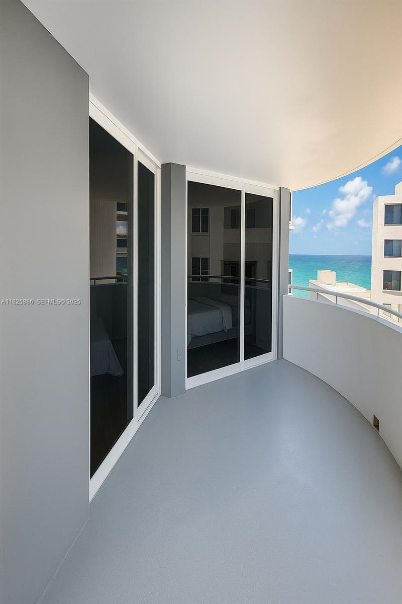 6301 Collins Avenue, Unit 1005 Miami Beach, FL 33141 - Photo 16 of 35 an empty room with windows