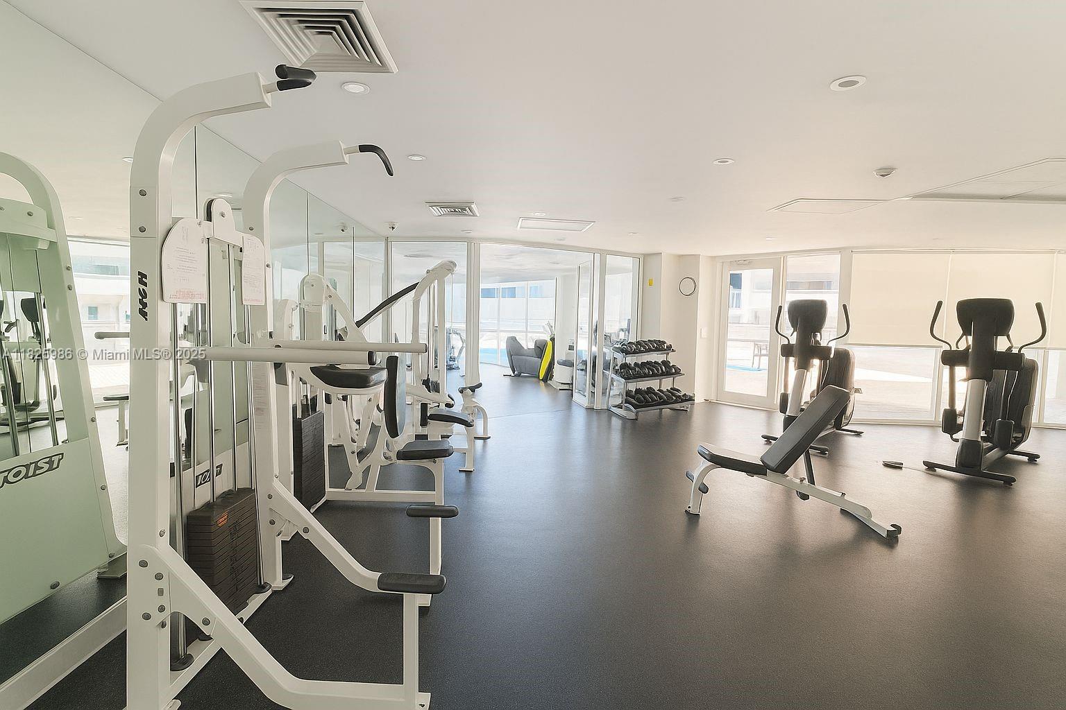 6301 Collins Avenue, Unit 1005 Miami Beach, FL 33141 - Photo 19 of 35 a view of a room with gym equipment