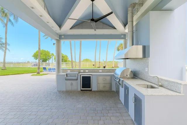 a kitchen with a sink and a stove top oven
