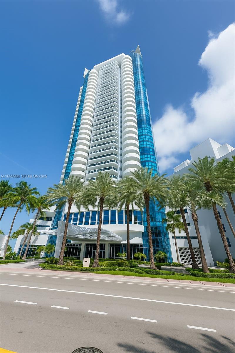 6301 Collins Avenue, Unit 1005 Miami Beach, FL 33141 - Photo 28 of 35 a view of a tall building next to a road