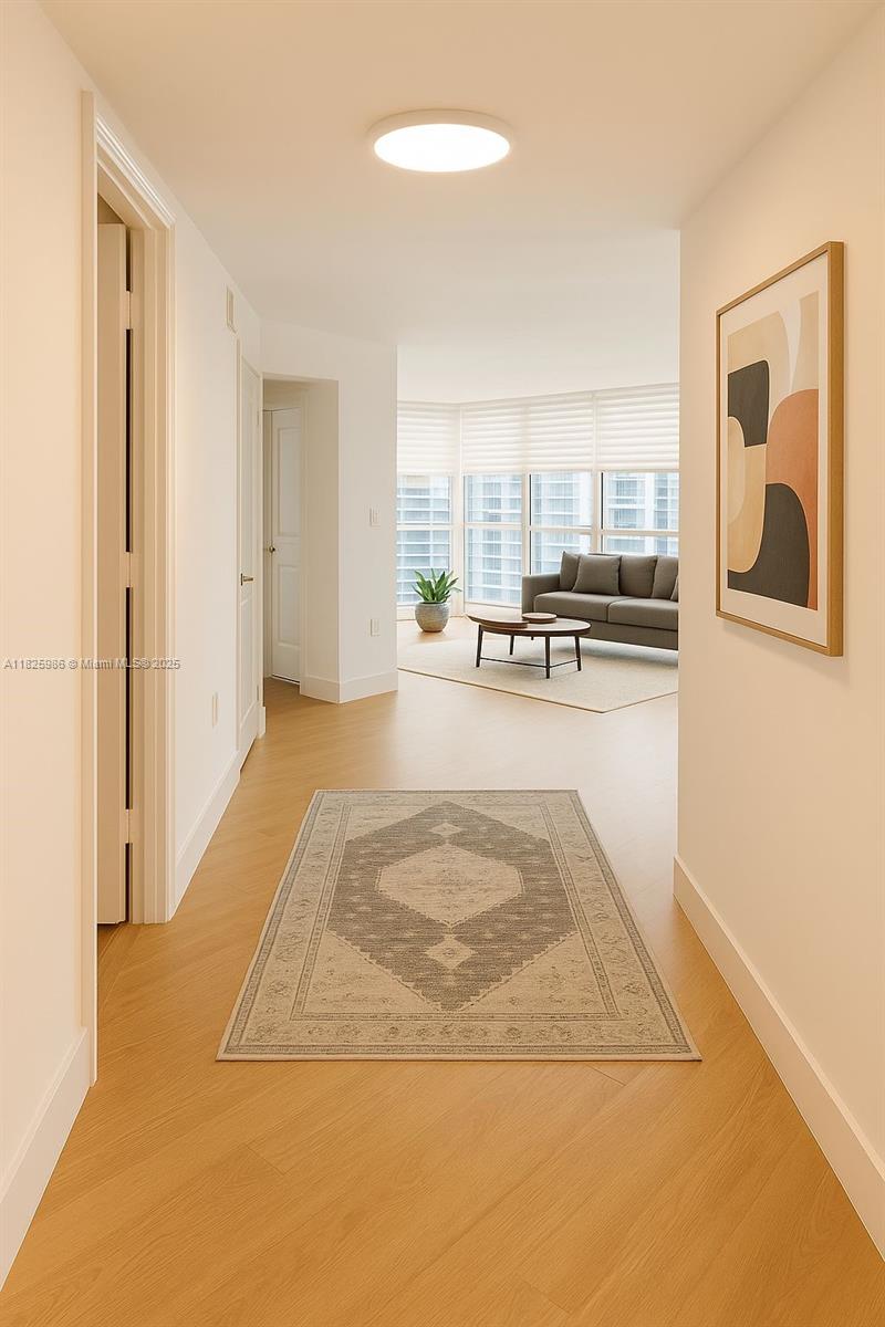 6301 Collins Avenue, Unit 1005 Miami Beach, FL 33141 - Photo 4 of 35 a view of a livingroom with furniture and window