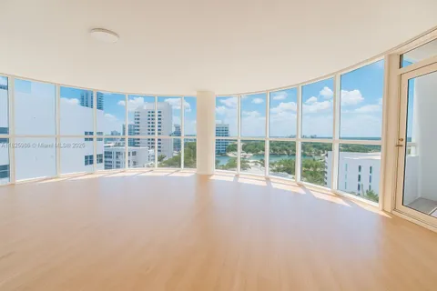 a view of an empty room with a balcony