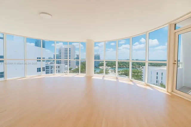 a view of an empty room with a balcony