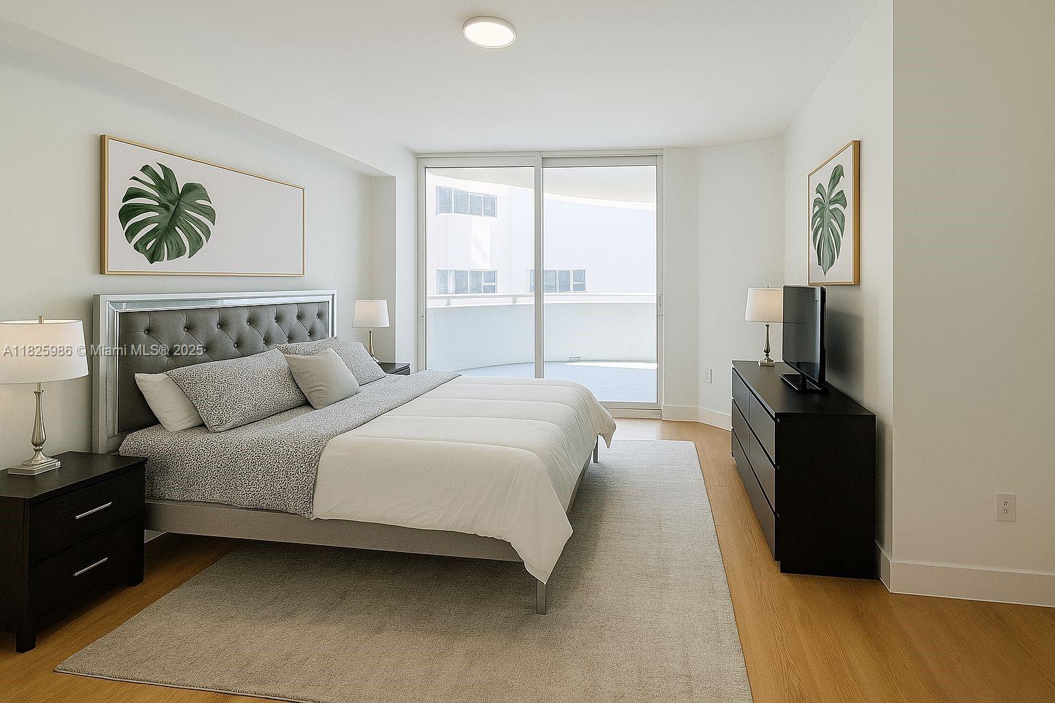 6301 Collins Avenue, Unit 1005 Miami Beach, FL 33141 - Photo 8 of 35 a bed room with a bed and a tv