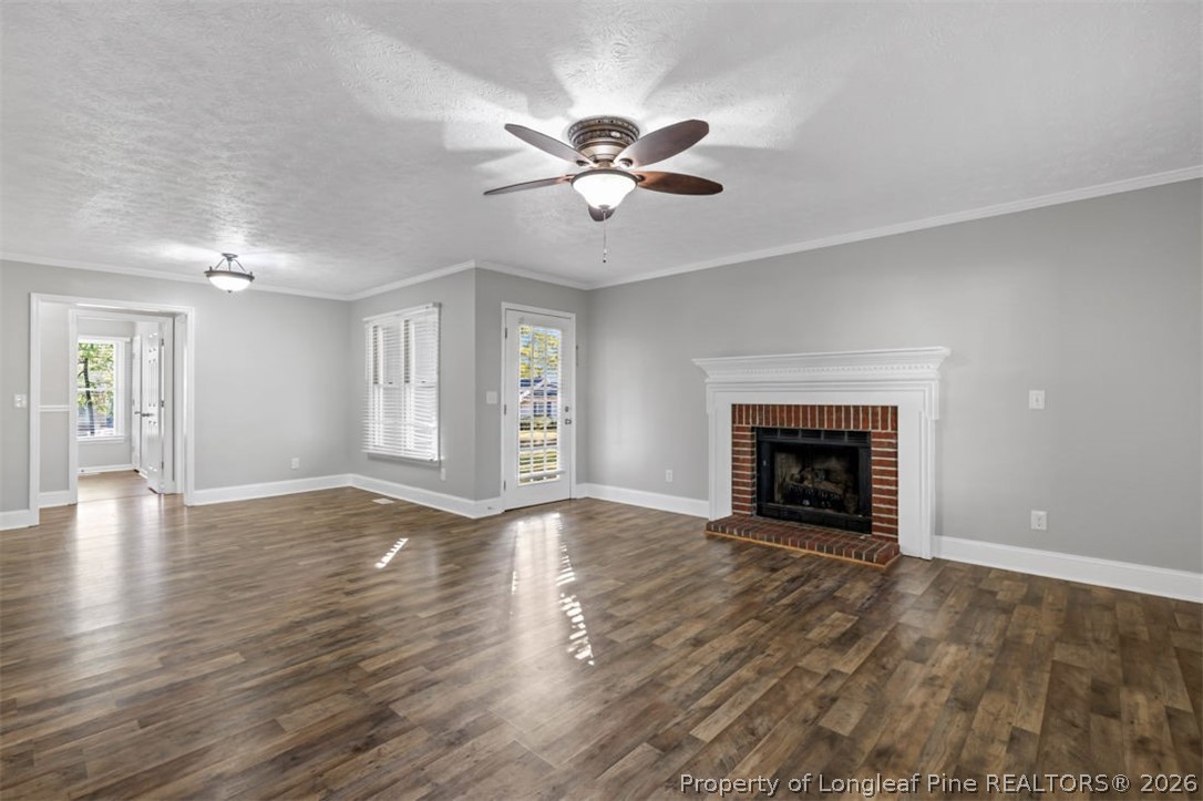 1205 Crossbend Court Fayetteville, NC 28314 - Photo 7 of 37 a view of an empty room with window and wooden floor