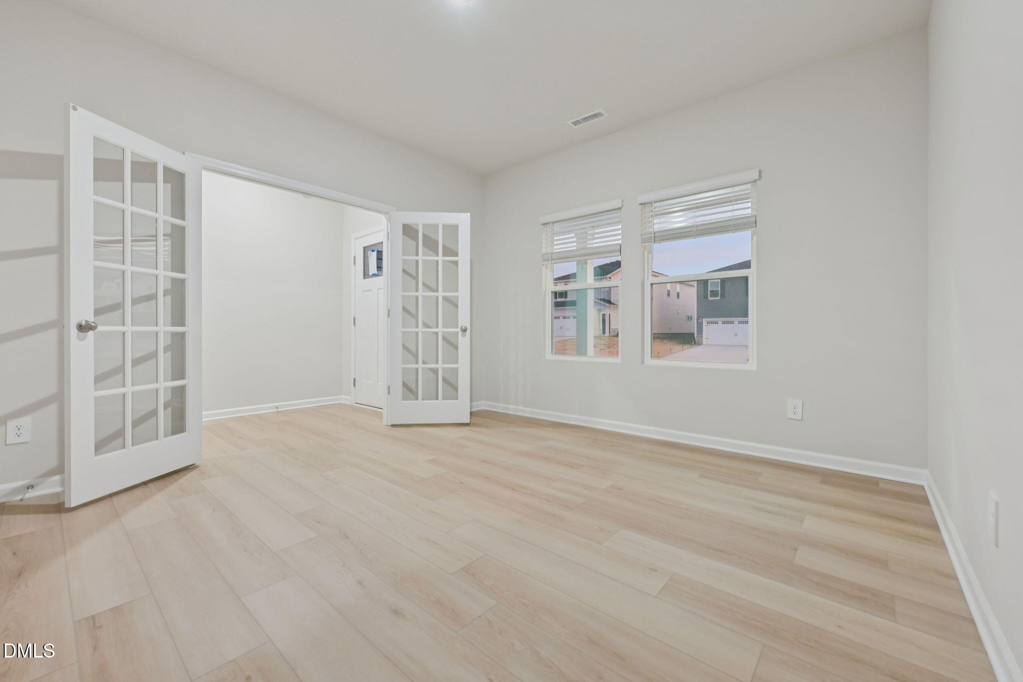 2147 Topsail Road Durham, NC 27703 - Photo 11 of 31 a view of an empty room with a window