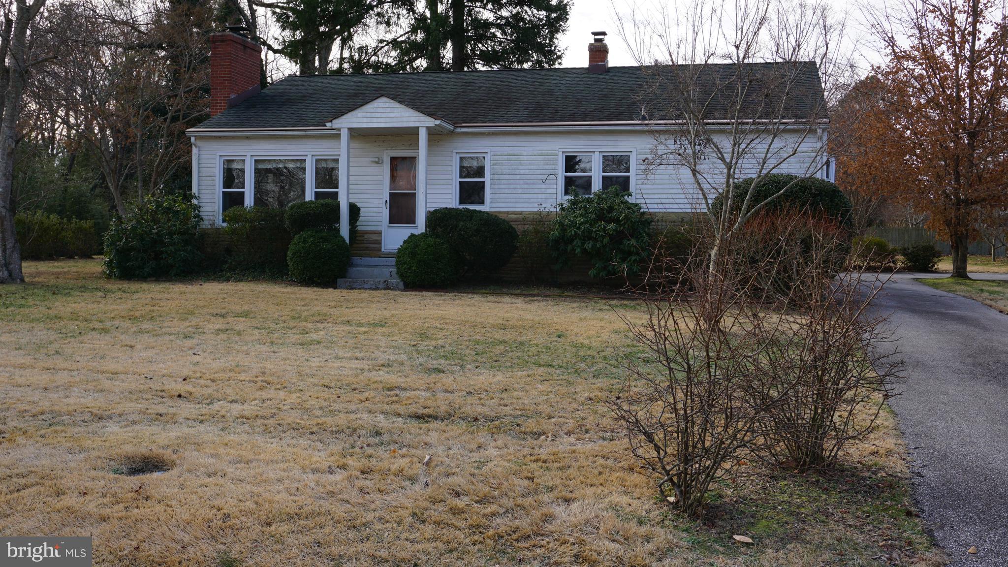 45927 Rolling Road Lexington Park, MD 20653 - Photo 2 of 31 a front view of a house with garden