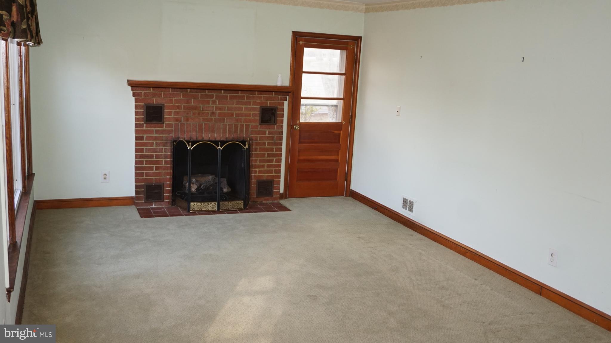 45927 Rolling Road Lexington Park, MD 20653 - Photo 12 of 31 a view of an empty room with a fireplace