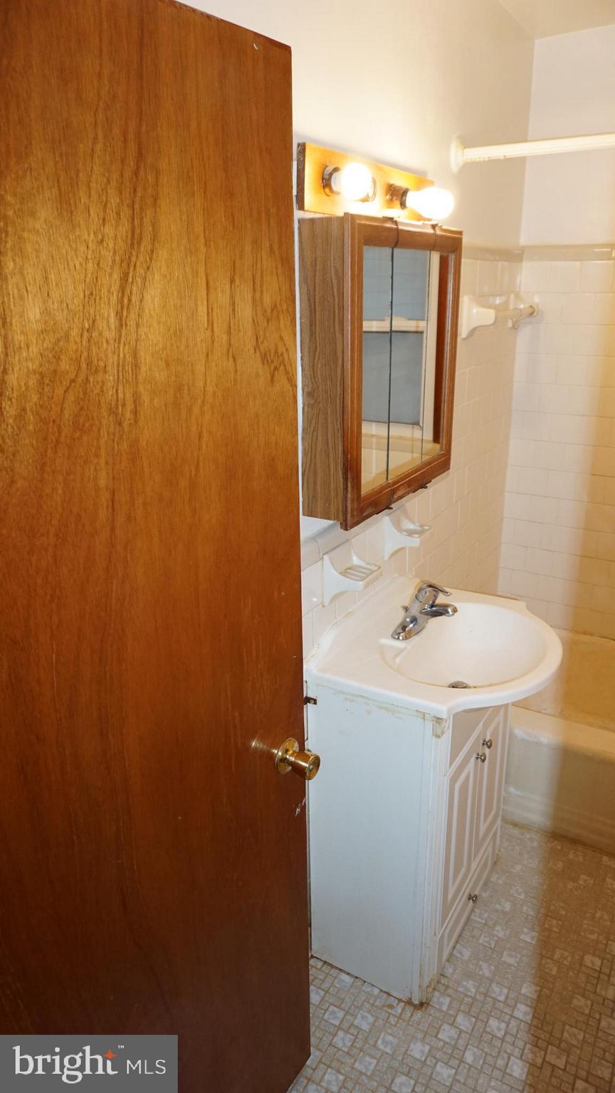 45927 Rolling Road Lexington Park, MD 20653 - Photo 22 of 31 a bathroom with a sink and a mirror