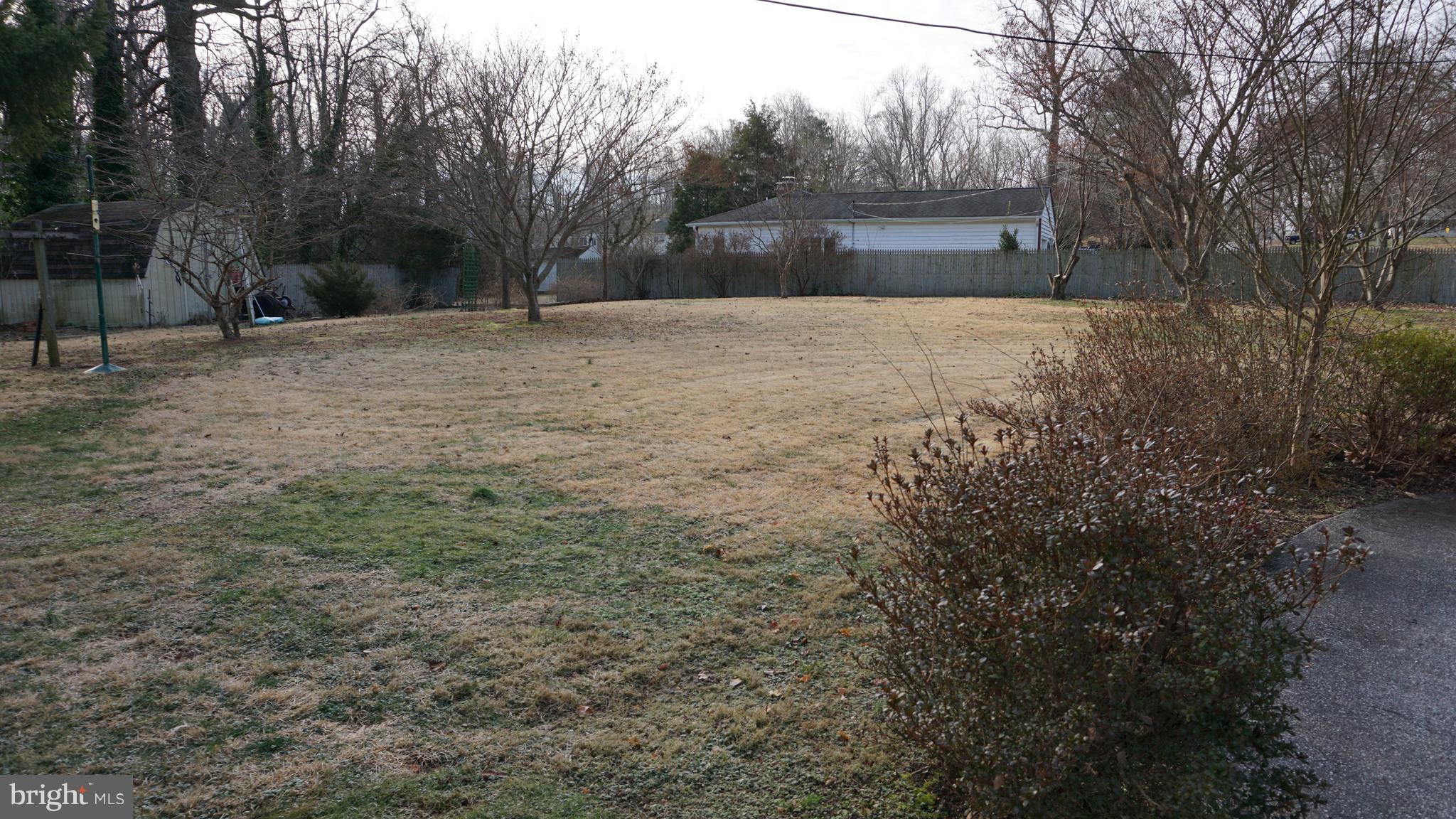 45927 Rolling Road Lexington Park, MD 20653 - Photo 25 of 31 a backyard of a house with lots of green space
