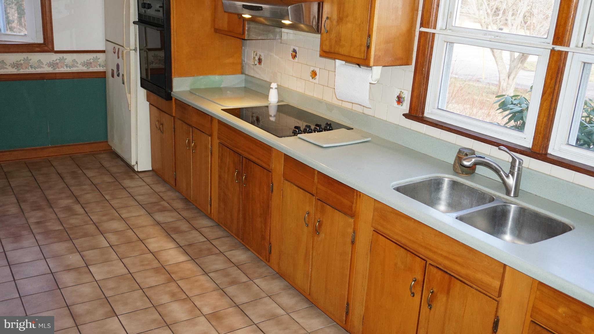 45927 Rolling Road Lexington Park, MD 20653 - Photo 8 of 31 a kitchen with stainless steel appliances a sink stove and cabinets