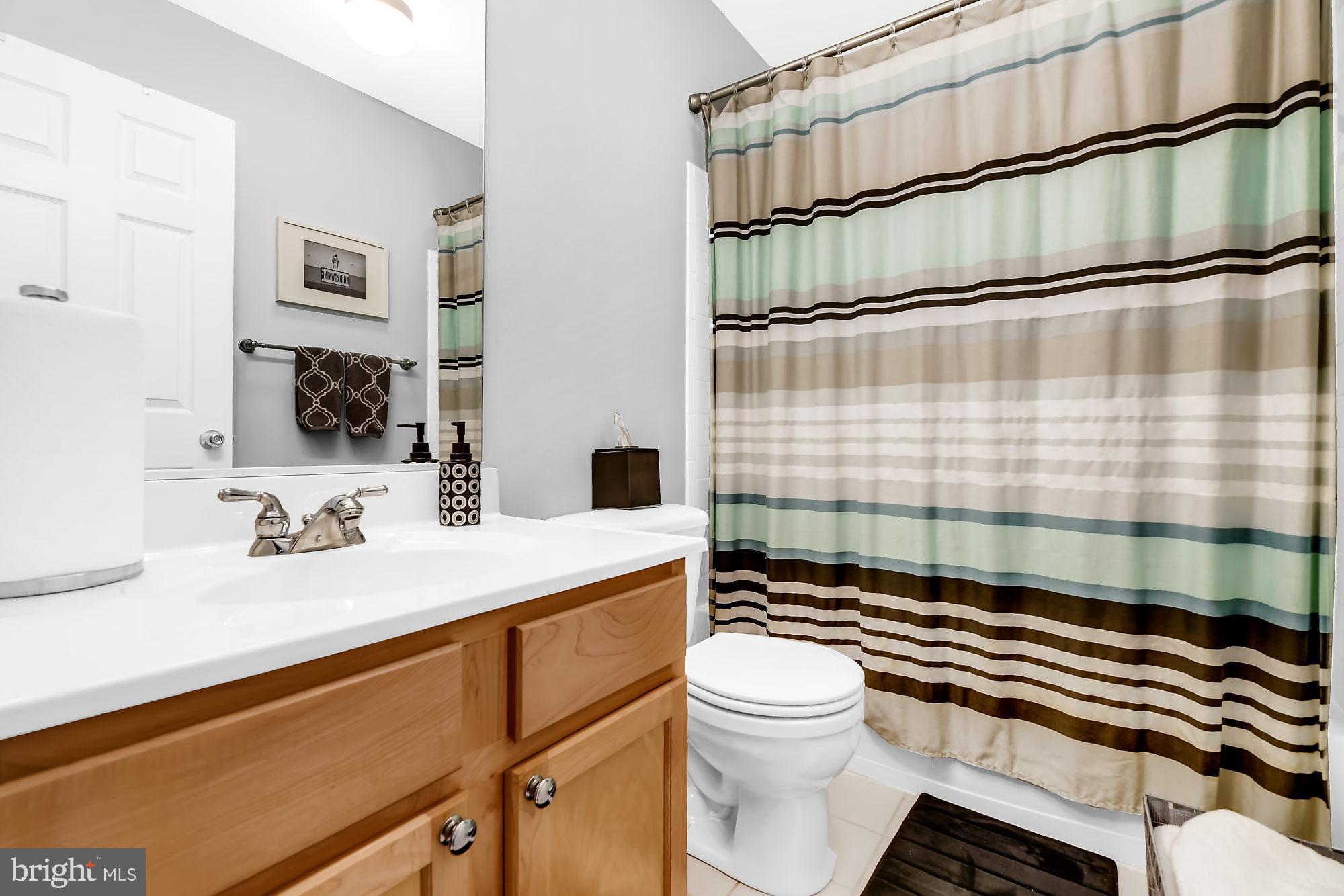 2090 Clipper Park Road Baltimore, MD 21211 - Photo 20 of 75 a bathroom with a sink a toilet and shower