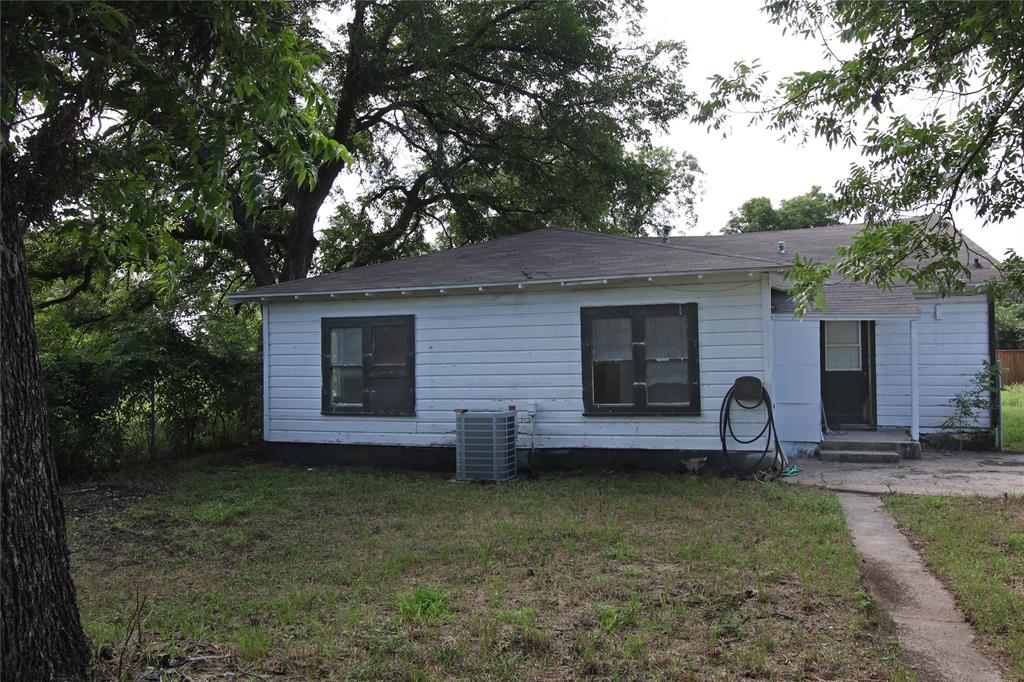 1508 Witt Street Waco, TX 76704 - Photo 32 of 37 View of back of property with a front yard and roof with shingles