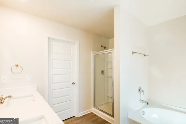 a bathroom with a tub and sink