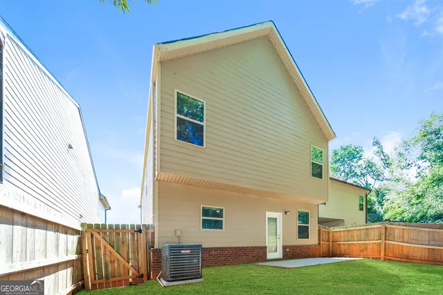 a view of house with backyard