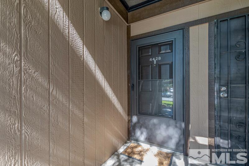4428 Matich Drive Reno, NV 89502 - Photo 1 of 26 a view of a hallway with wooden floor and entryway
