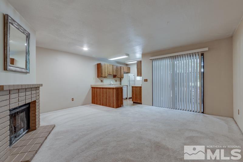 4428 Matich Drive Reno, NV 89502 - Photo 2 of 26 a view of an empty room with a fireplace