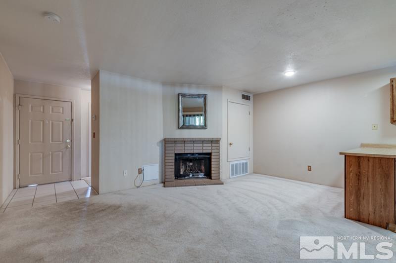 4428 Matich Drive Reno, NV 89502 - Photo 3 of 26 an empty room with fireplace