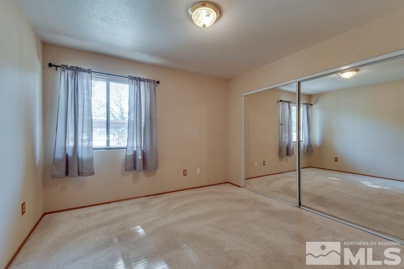 4428 Matich Drive Reno, NV 89502 - Photo 6 of 26 a view of an empty room with a window