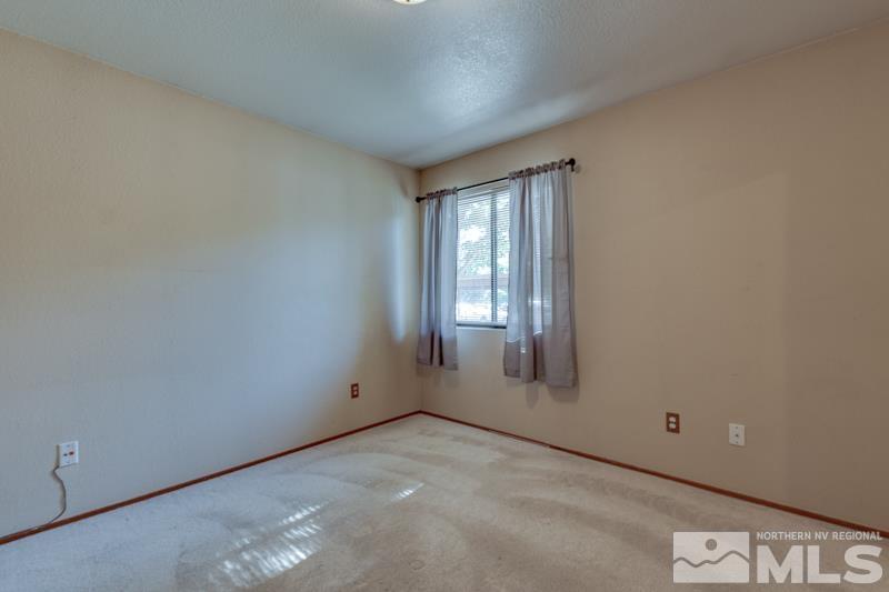 4428 Matich Drive Reno, NV 89502 - Photo 7 of 26 a view of an empty room with a window