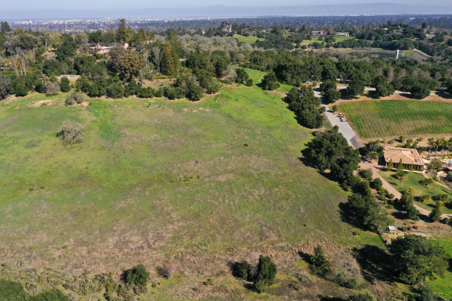 385 Moore Road Woodside, CA 94062 - Photo 3 of 25 an aerial view of a houses with a yard