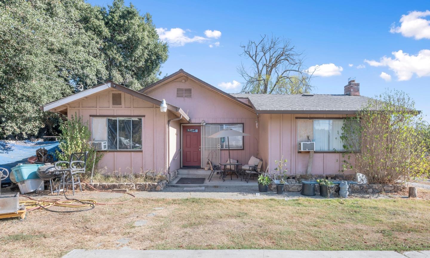 10650 Center Avenue Gilroy, CA 95020 - Photo 1 of 5 a front view of a house with garden