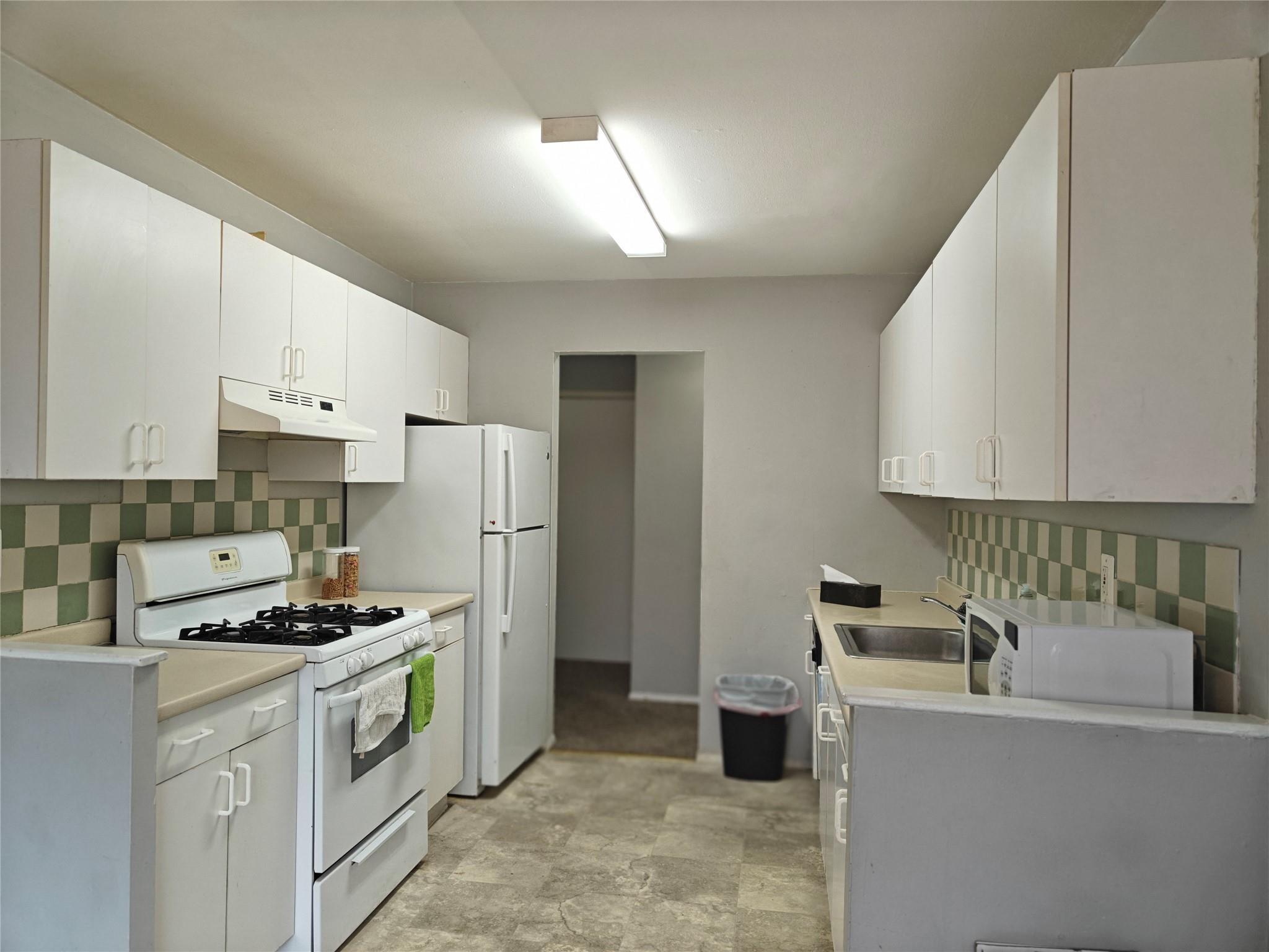 3 Hook Road, Unit 14E Poughkeepsie, NY 12601 - Photo 1 of 1 a kitchen with refrigerator and cabinets
