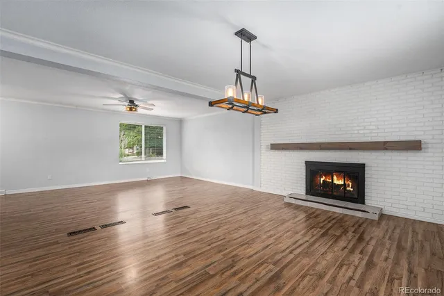 a kitchen with a sink a counter top space and stainless steel appliances