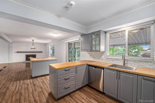 a kitchen with cabinets and stainless steel appliances