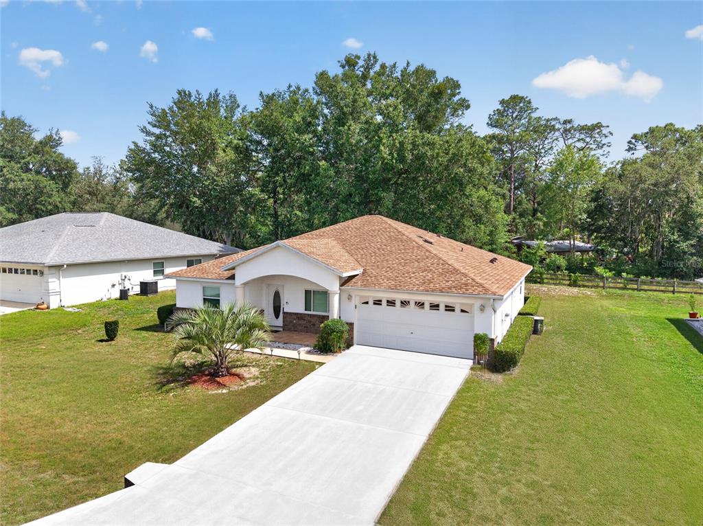 6032 Southwest 103rd Loop Ocala, FL 34476 - Photo 24 of 28 a view of a house with garden