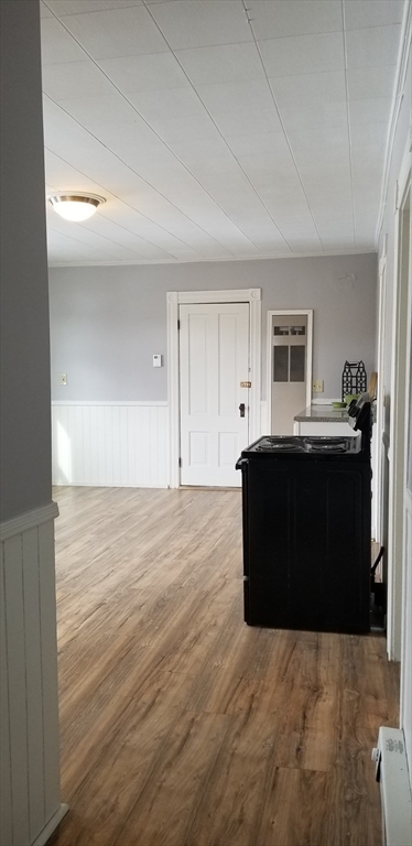 9 Pine Street, Unit 2 Dudley, MA 01571 - Photo 5 of 6 a living room with a couch and a wooden floor