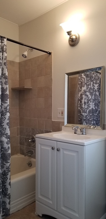 9 Pine Street, Unit 2 Dudley, MA 01571 - Photo 6 of 6 a bathroom with a sink and a bathtub