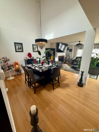 a living room with furniture and a chandelier