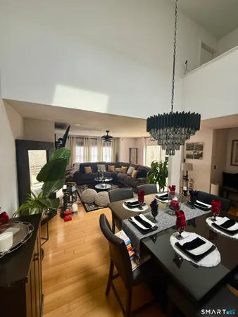 a living room with furniture fireplace and potted plant