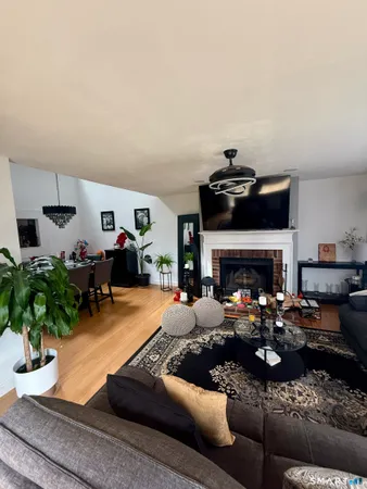 a view of a livingroom with closet and cabinet