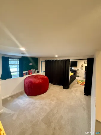 a room with furniture and a flat screen tv