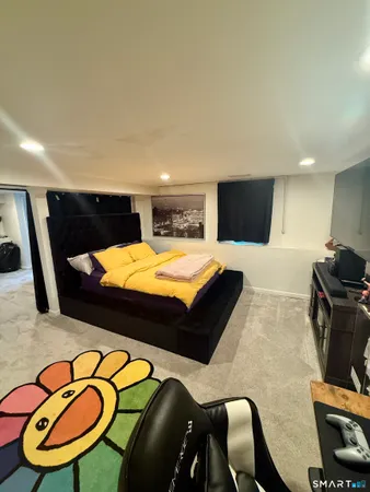 a room with furniture and a flat screen tv