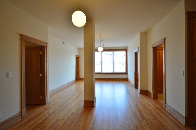 Undisclosed Address Chicago, IL 60657 - Photo 4 of 9 a view of a room with wooden floor