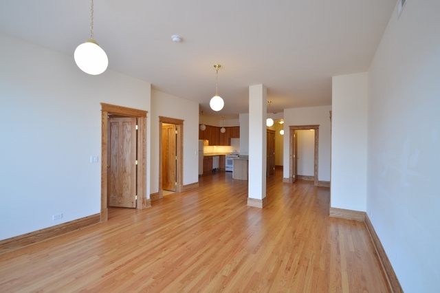 Undisclosed Address Chicago, IL 60657 - Photo 5 of 9 a view of a room with wooden floor