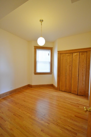 Undisclosed Address Chicago, IL 60657 - Photo 8 of 9 a view of an empty room and window