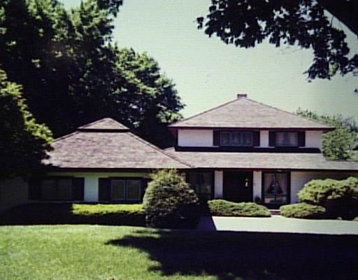 410 Hilltop Road Bridgeport, CT 06605 - Photo 1 of 1 a front view of a house with a garden