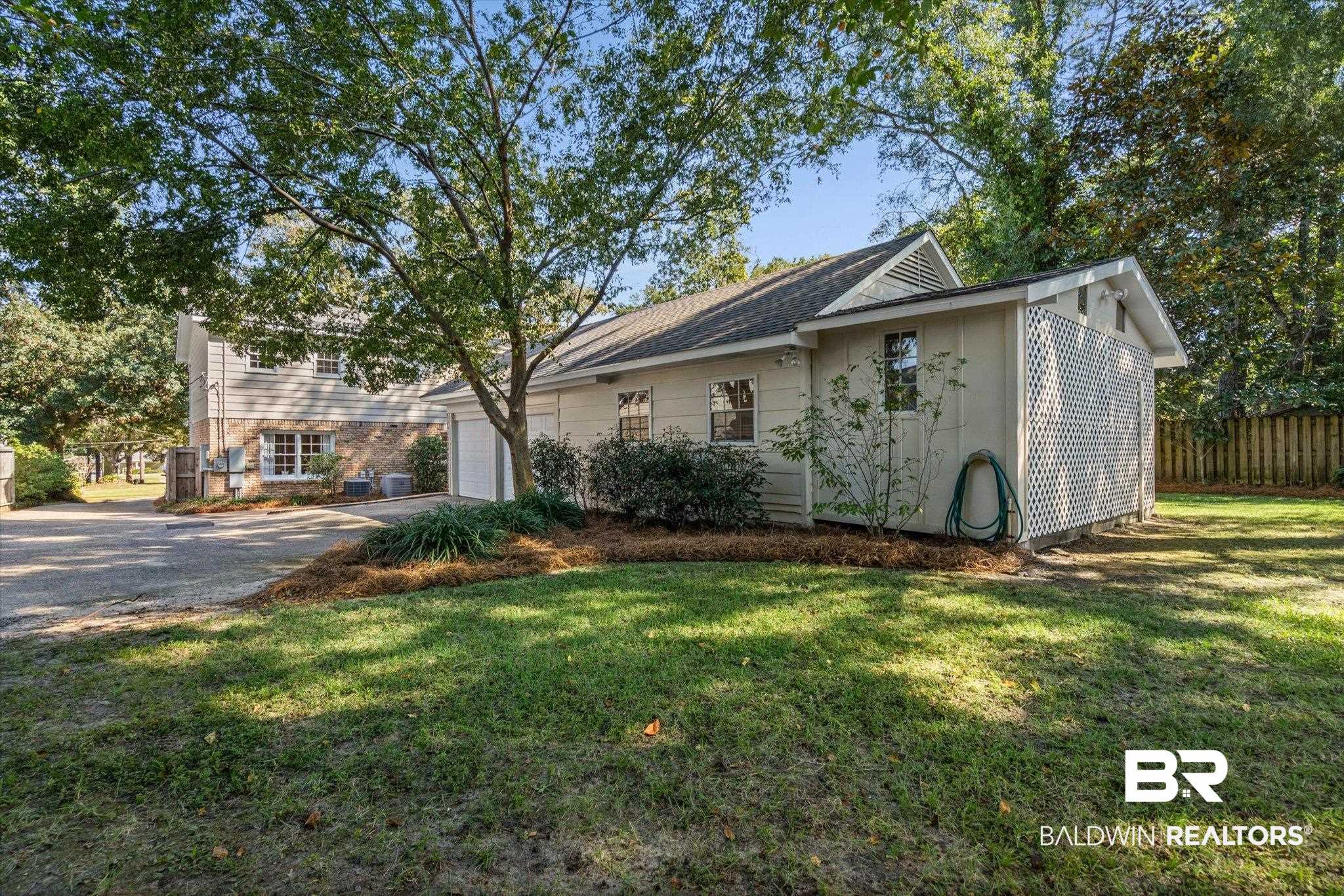 513 Spring Park Drive East Mobile, AL 36608 - Photo 37 of 44 View of front of home featuring driveway and a garage