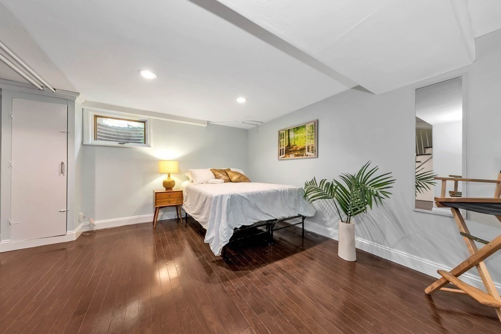 18 Pierce Road, Unit 18 Watertown, MA 02472 - Photo 12 of 38 a bed room with a bed and a potted plant