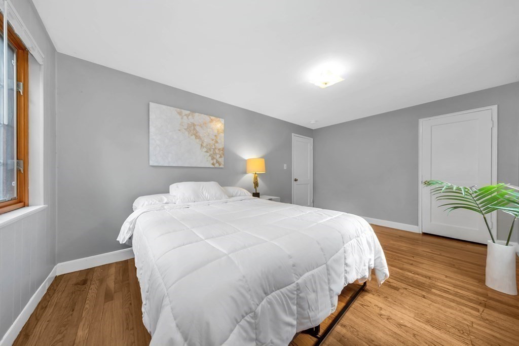 18 Pierce Road, Unit 18 Watertown, MA 02472 - Photo 15 of 38 a bed sitting in a bedroom next to a window