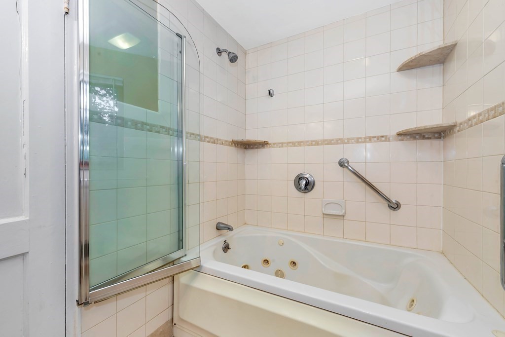 18 Pierce Road, Unit 18 Watertown, MA 02472 - Photo 17 of 38 a bathroom with a bathtub and shower