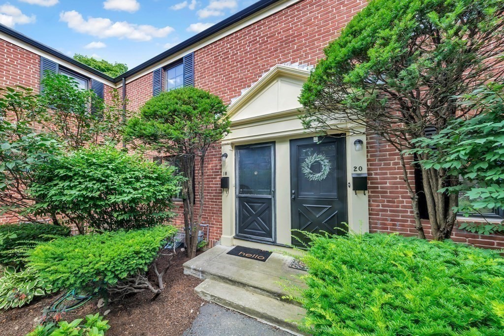 18 Pierce Road, Unit 18 Watertown, MA 02472 - Photo 18 of 38 a front view of a house with garden