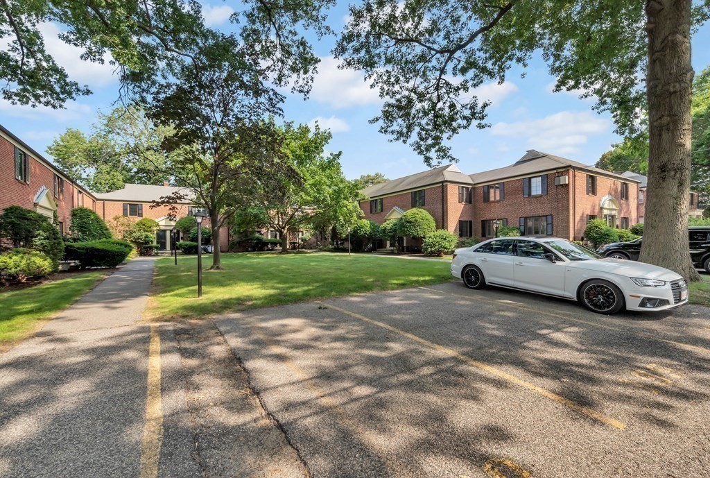 18 Pierce Road, Unit 18 Watertown, MA 02472 - Photo 19 of 38 a view of a street with a car parked in front of it